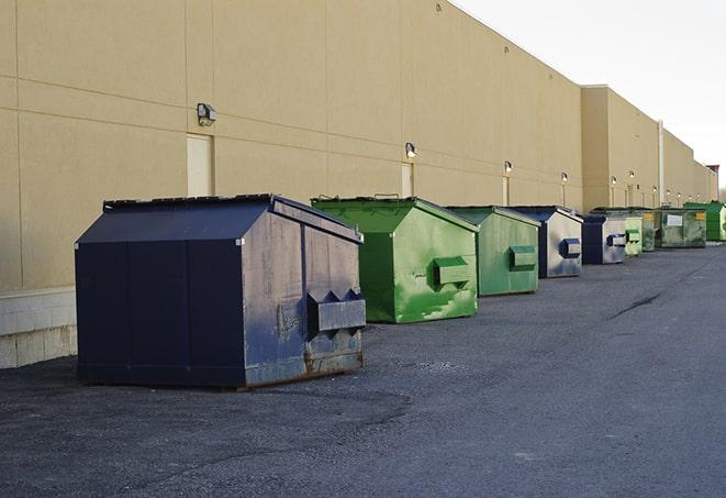 a row of large construction dumpsters on-site in Hampton